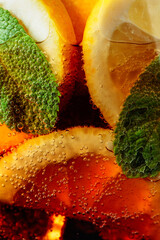 Carbonated drink with lemon slices and mint.