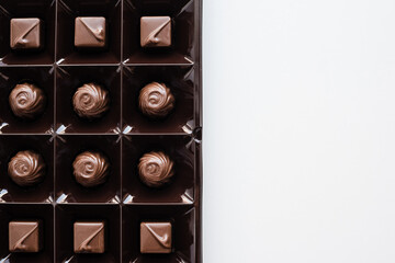 assorted candies on a white background, candies in a box, a set of chocolates, chocolates 