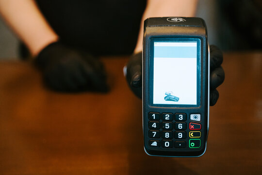 Unrecognizable person holding a tpv