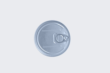 Closed metal can of canned food on white background. View from above.