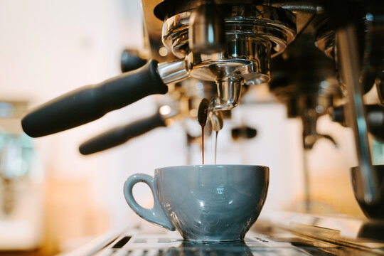 Coffee machine preparing an espresso coffee