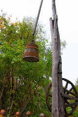 Detail of a traditional old wooden well with a bucket, Poltava region, Ukraine