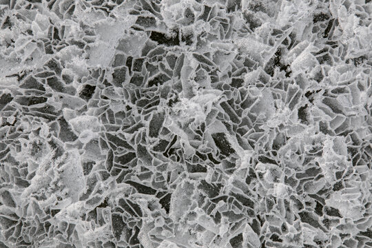 Top view ice abstract pattern of frozen Lake Baikal on cloudy winter day