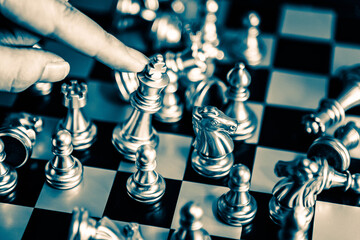 Chess board game to represent the business strategy with competition in the world market. and find...