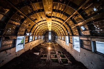 Perspective view of cabin of crashed airplane abandoned in nature in winter in Iceland