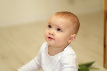 Family lifestyle shooting. Selective focus. Warm magazine tint, added noise.Kid looks at mom, portrait