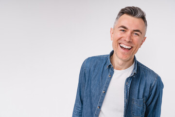 Cheerful laughing caucasian man in casual clothes isolated over white background