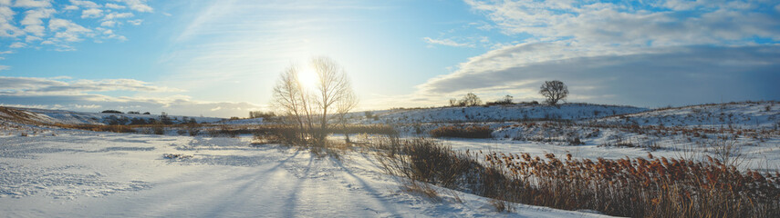 Winter landscape with frozen river