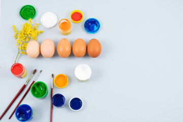 Eggs and paints. Easter eggs decoration process.