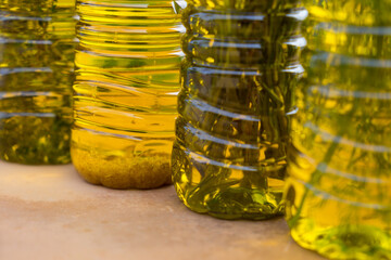 close-up of aromatic golden olive oils in various flavors with mediterranean herbs and garlic