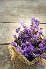 Fresh lavender flower on wooden table. Summer flower background.