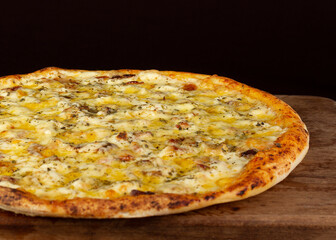 Isolated pizza with breast chicken and cream cheese, on wooden board 