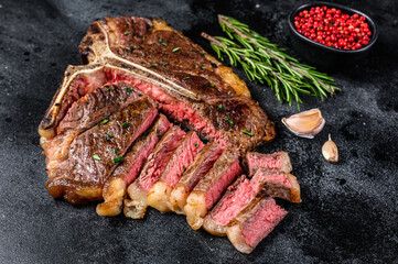 Grilled italian Florentine or  t bone beef meat Steak. Black background. Top view