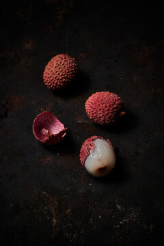 Top view of lychee on dark rustic wooden background