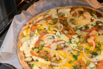 Homemade pizza. Pizza in the oven. Family evening. Homemade baking. Bake. Pizza. Leisure at home. Cooking. Recipes.