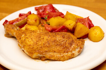 Roasted chicken drumstick with paprika and potatos 