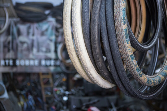 Various types of rubber tires for repairing wheels of bikes in modern garage