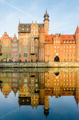Fototapeta premium St. Mary's gate, Brama Mariacka water reflection, Motlawa River Embankment, Gdansk, Poland