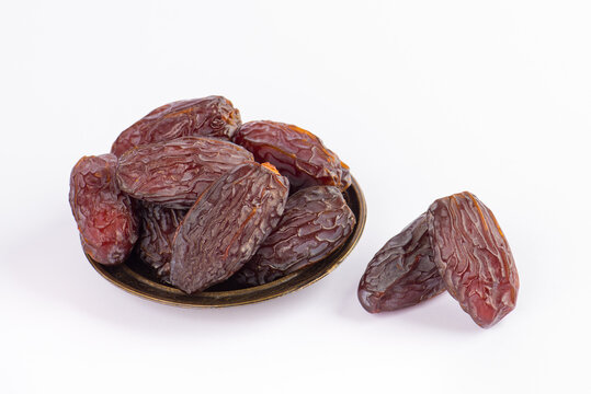 HURMA, Dates. Dried dates fruit on white background. Popular fruit of Ramadan.