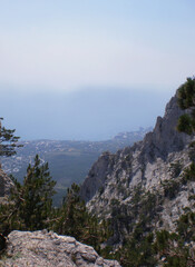 Mountain landscape against blue sky and valley below