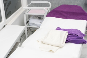 An empty bed in a beauty salon prepared for a new client.