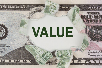 The dollar is torn in the center. In the center it is written - Value