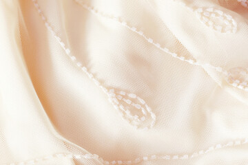 elegant light pastel fabric with embroidery beads, aesthetic background