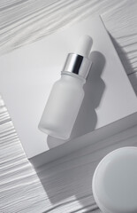 Top view of Pipet bottle on white box and white table