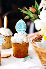 Homemade Easter cakes are decorated with craft cookies and painted with icing