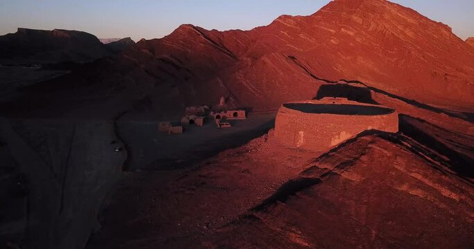 Fly Over an Old Religious Cemetery of Zoroastrian People in the Mountain in Yazd in Iran in Sunset time - Scary Big Shadows Before Night - Ritual Building for Dead People