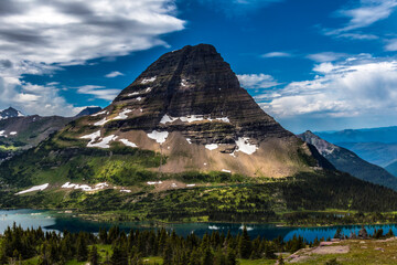 Views from the Hidden Trail in Glacier national park in Montana during summer. wild flowers, towering Bear Hat Mt and Mt . Reynolds can be seen in this hike.