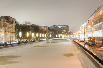 Fototapeta na wymiar Moscow, Russia, Feb 25, 2021: Embankment of Vodootvodny Canal near Garden Ring. Evening. Winter