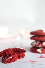 Red cookies decorated with powdered sugar
