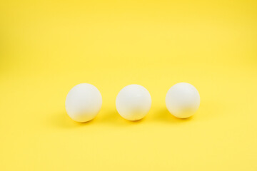 Eggs on the yellow background