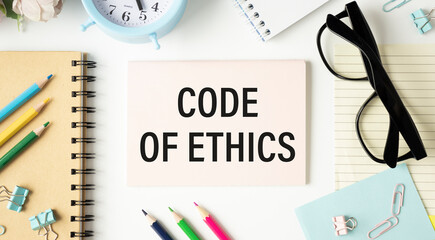 Code of Conduct text on notebook. Concept of ethical integrity, value and ethics.