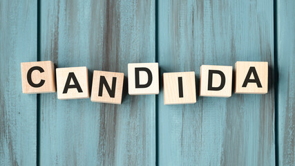 Candida word on wooden cube, concept on cubes