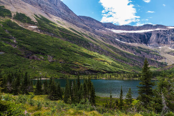 dramatic summer mountain ranges and mountain peaks in the vast Glacier National Park in Montana.