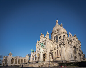 Fototapeta na wymiar Paris, France - 02 26 2021: Montmartre district. View of the Basilica of sacred heart