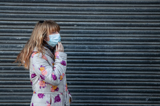 woman with mask on the street outdoors