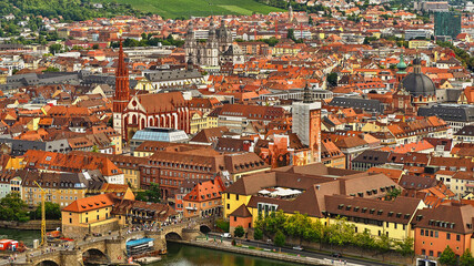 View from above of the Wuerzburg old town from the Middle Ages with its red tile roofs and the many churches.