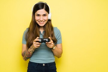 Portrait of a excited young woman playing a videogame