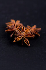 Close-up of aniseed stars on black background