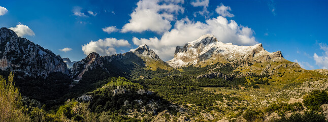 mountains with snow  and clouds in the tramuntana area on the balearic island of mallorca, spain