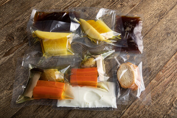 Different products and sauces in vacuum sealed plastic packaging