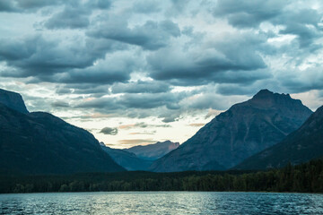 dramatic, peaceful and  serene summer  sunset photo of Lake McDonald in Glacier National Park in. Montana.