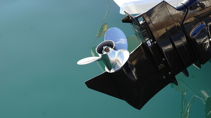 motor propellers boat against water © Esteve
