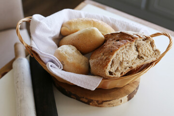 Fresh bread and fragrant buns in a basket