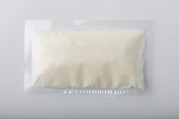 White cream in vacuum sealed plastic bag