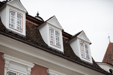 Beautiful ancient streets of Brasov, Romania. Medieval architecture. Beautiful places and landscapes. Cafes, churches, council square. Old town in rainy weather.