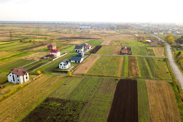 Aerial view of home roofs in residential rural neighborhood area.